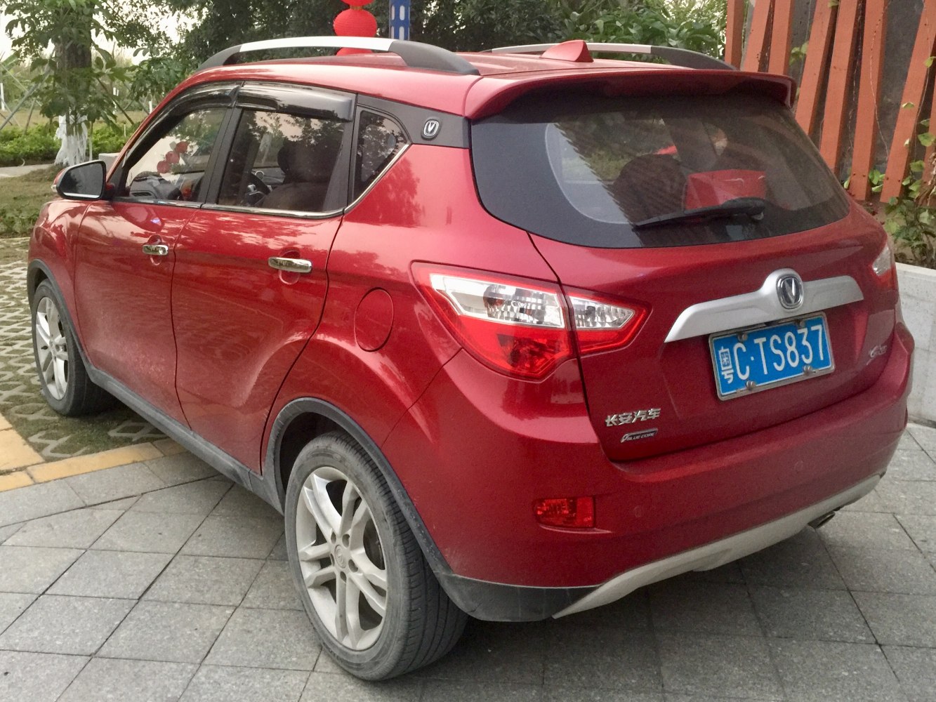Red compact SUV rear view with spoiler and alloy wheels