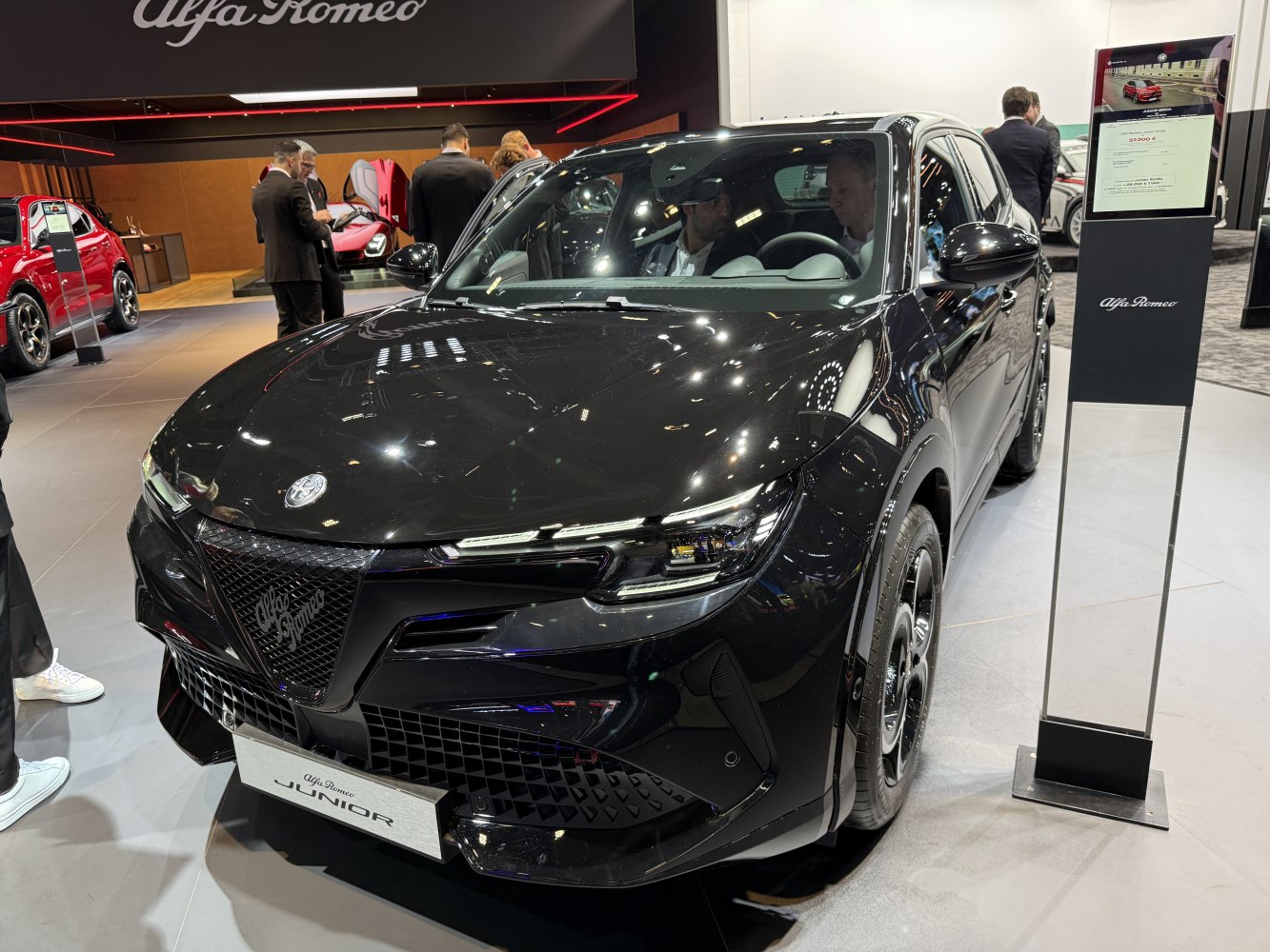 Front view of black SUV with LED headlights and mesh grille