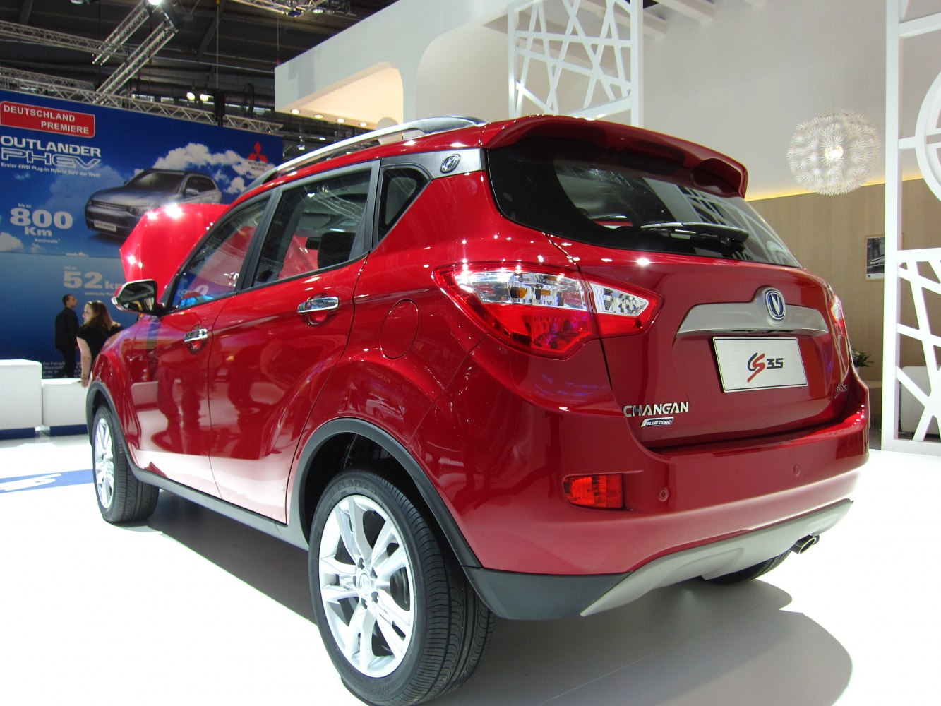 Red crossover SUV rear side with taillights and alloy wheels