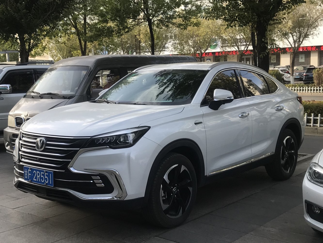 SUV front grille with chrome accents and black alloy wheels