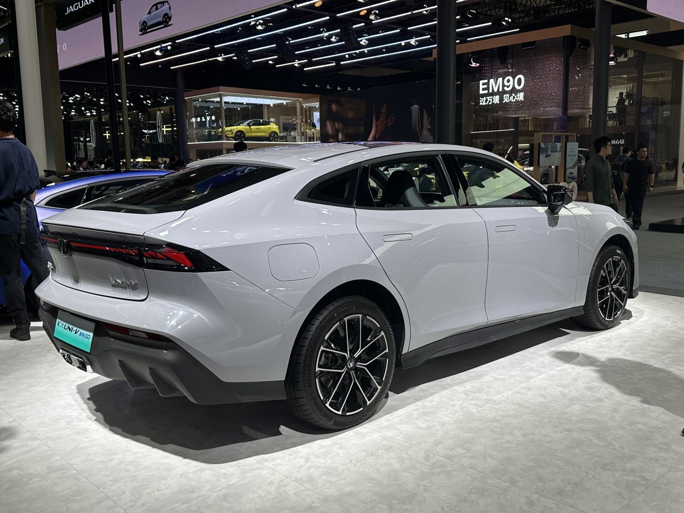 Rear and side view with sharp tail lights and aerodynamic design