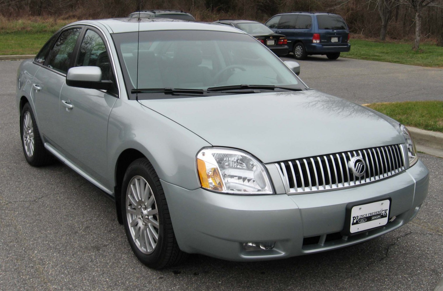 Front view showing vertical grille and headlights of a mid-2000s sedan