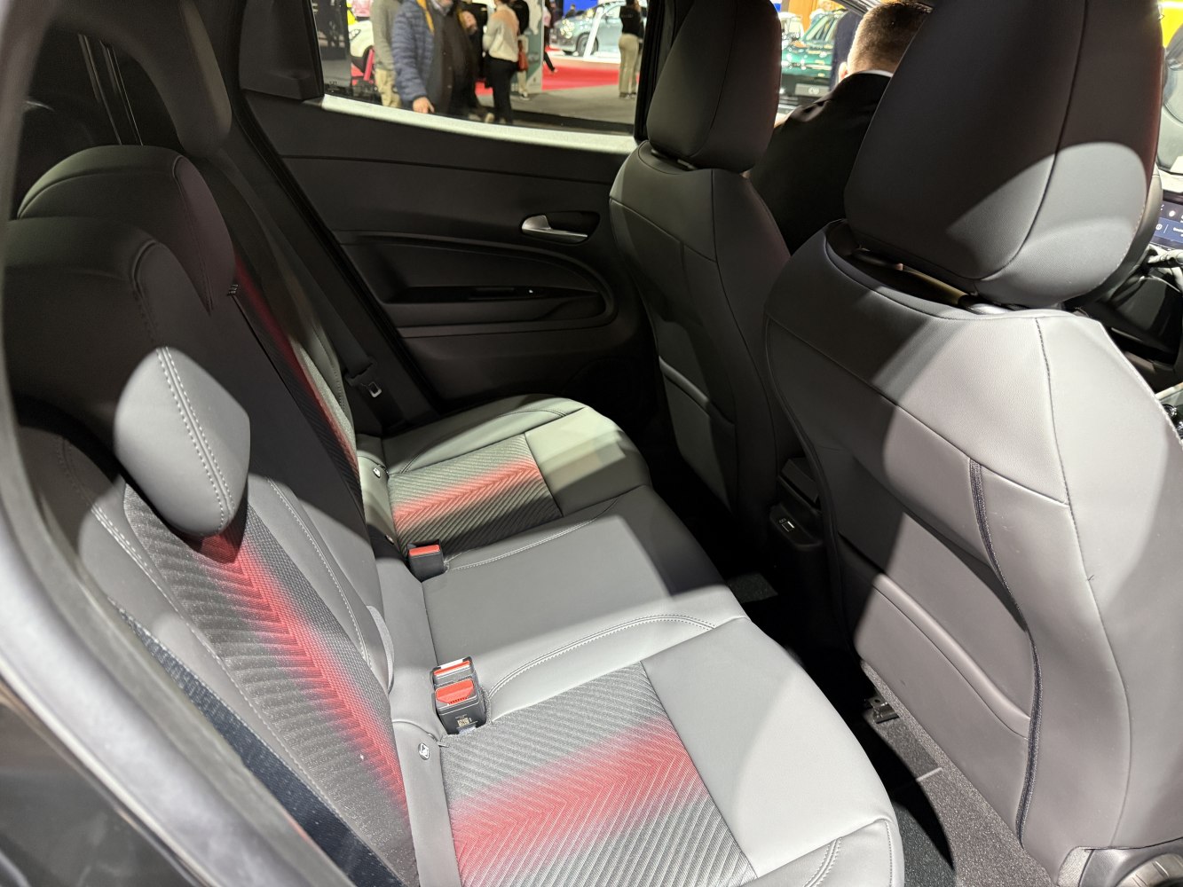 Rear seats with leather upholstery and modern styling in a compact vehicle
