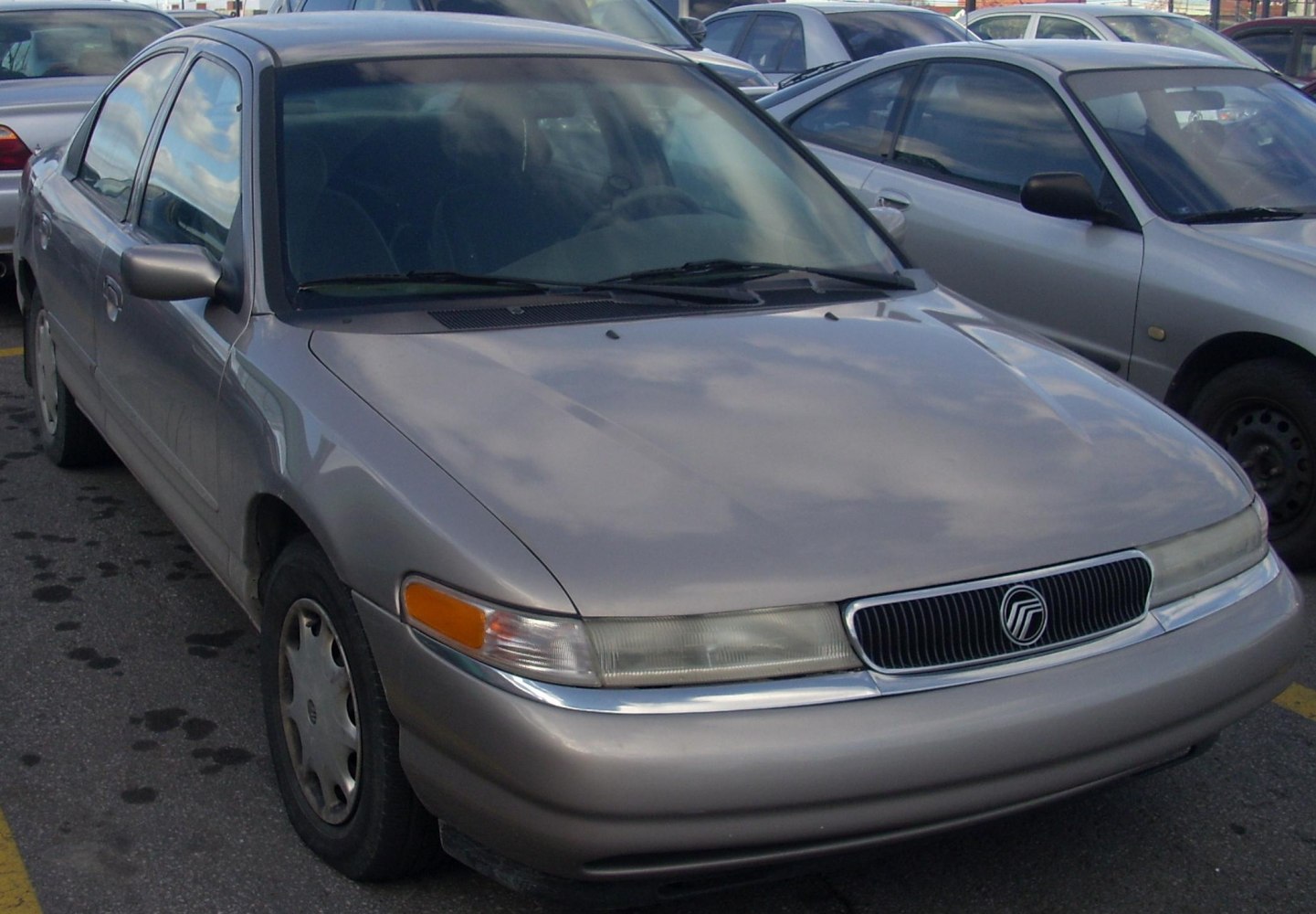 Front angled view showcasing grille and integrated headlights