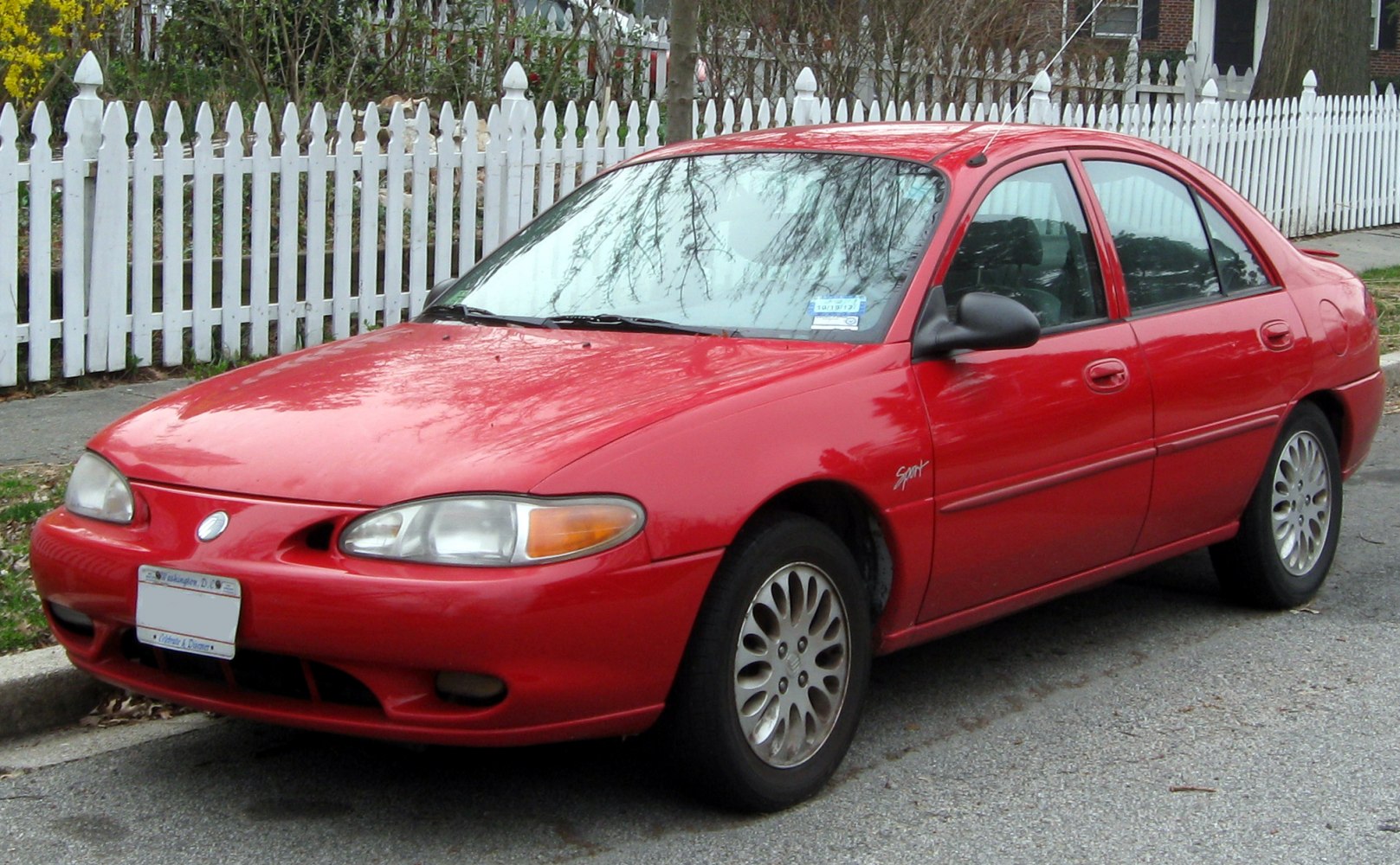 Compact sedan front and side view with alloy wheels and sporty trim