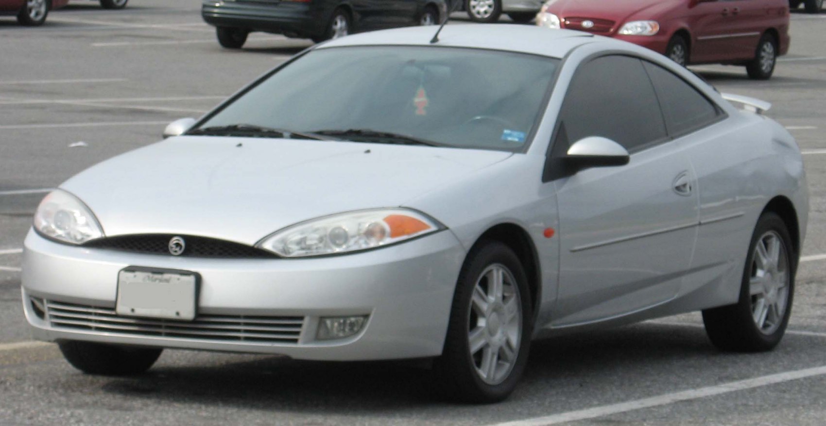 Silver coupe with sleek sporty design showing front and side views
