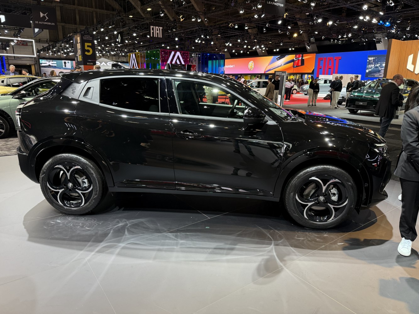 Black compact crossover SUV side view with distinctive alloy wheels