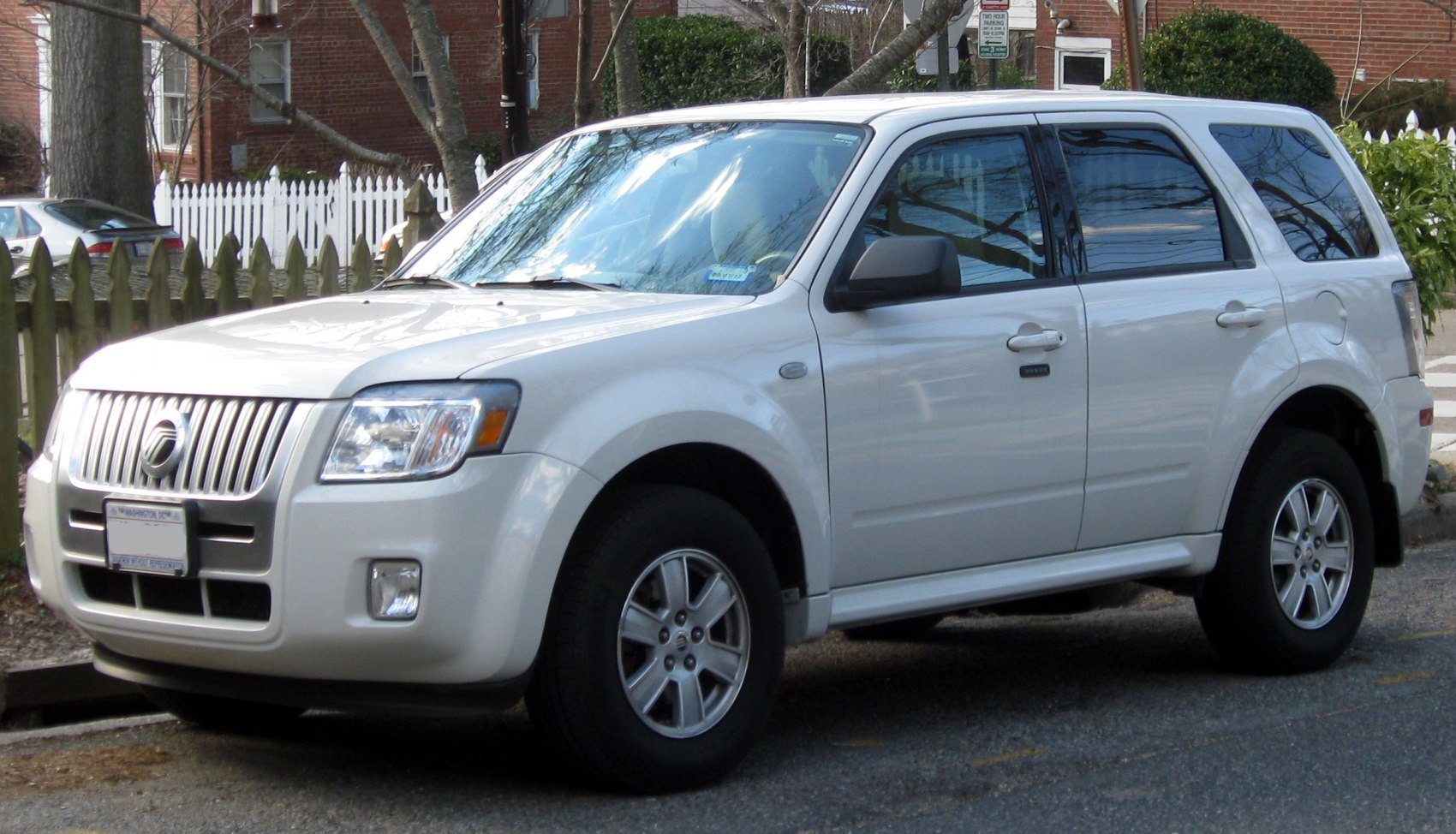Front-side view of SUV with chrome grille and alloy wheels
