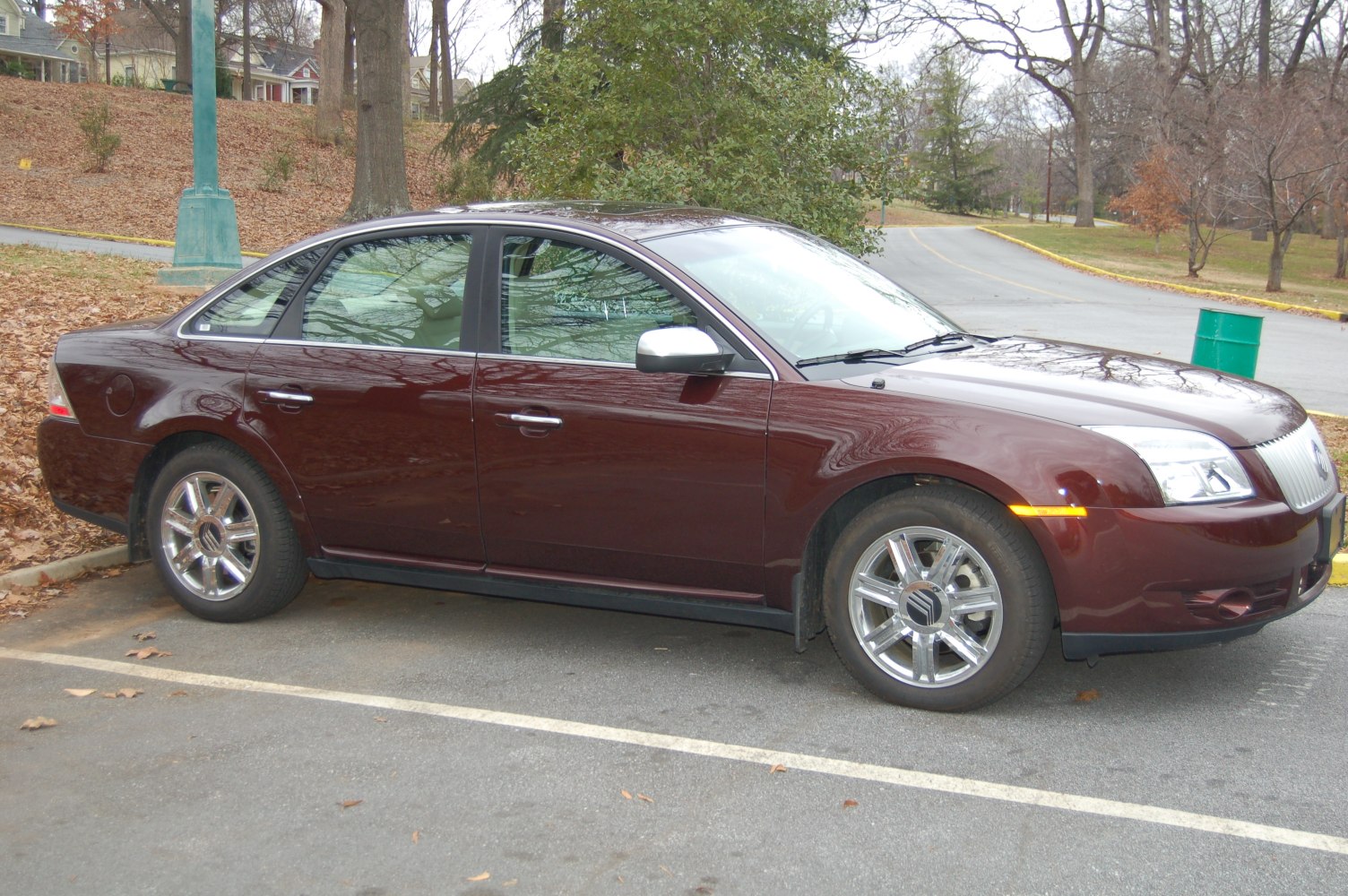 Four-door sedan with chrome wheels and sleek side profile