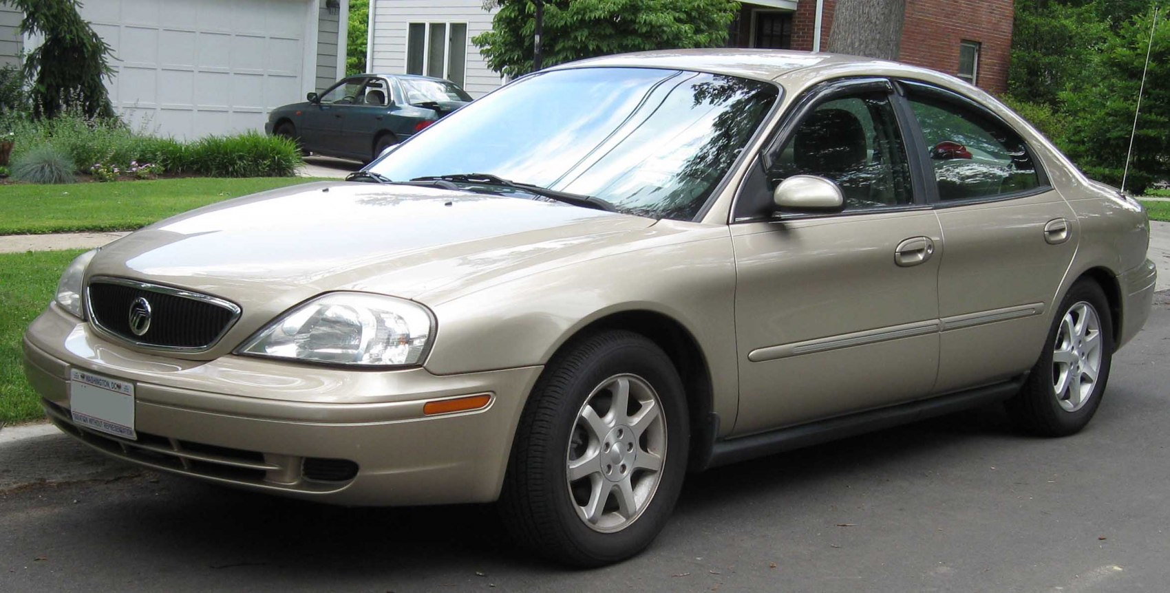 Front side profile of sedan with alloy wheels