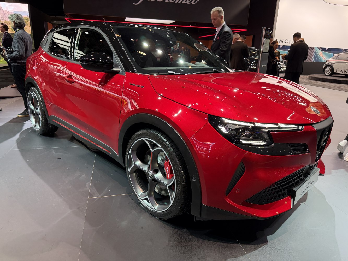 Close-up of front side with modern headlights and alloy wheels