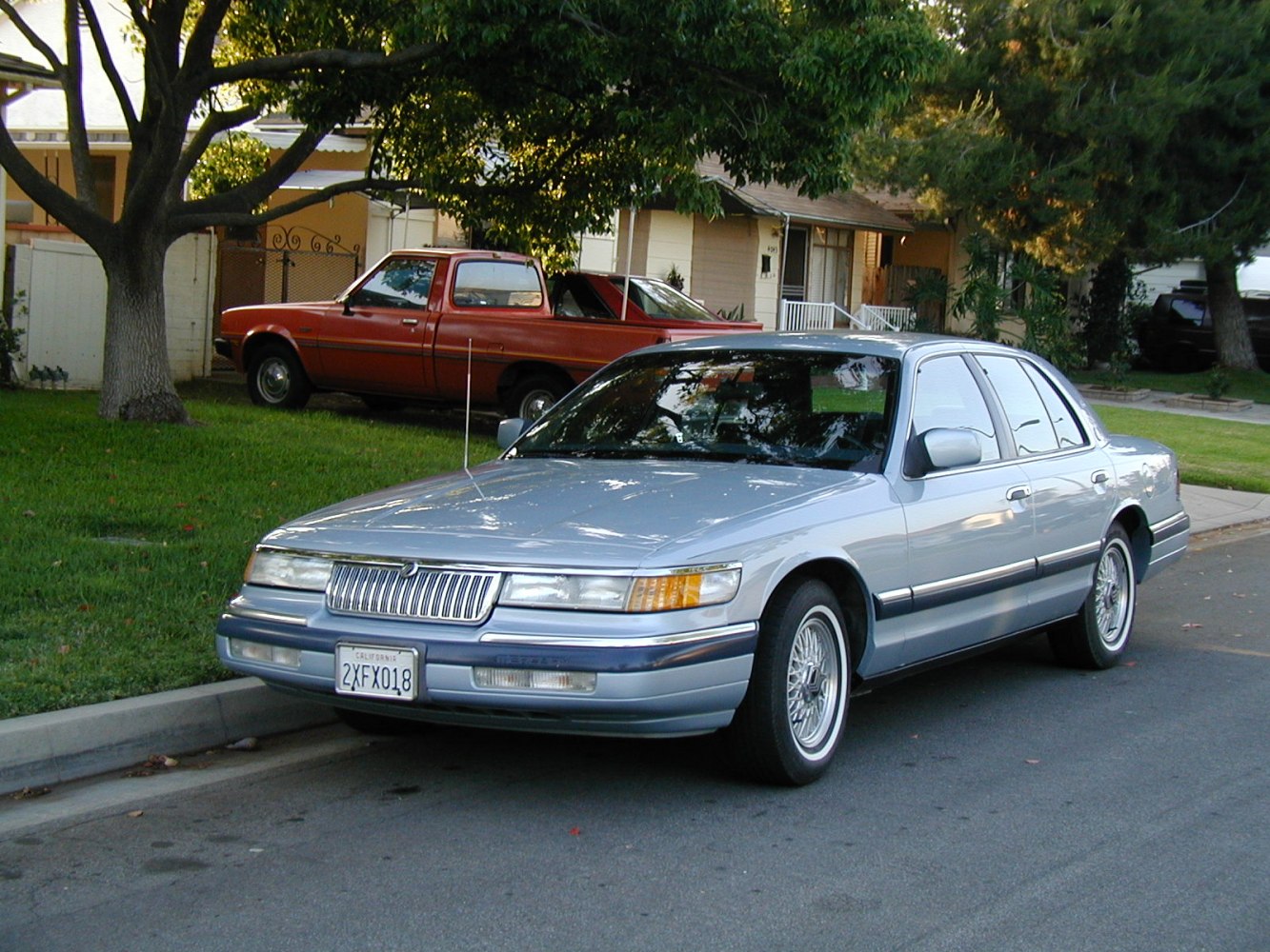 Front exterior view with classic wire-spoke wheels