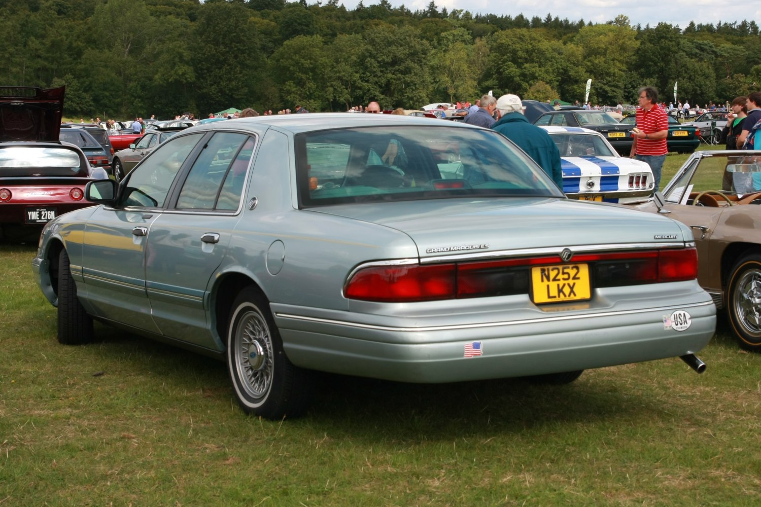 Rear view of a classic vintage sedan with distinctive tail lights and full-size design