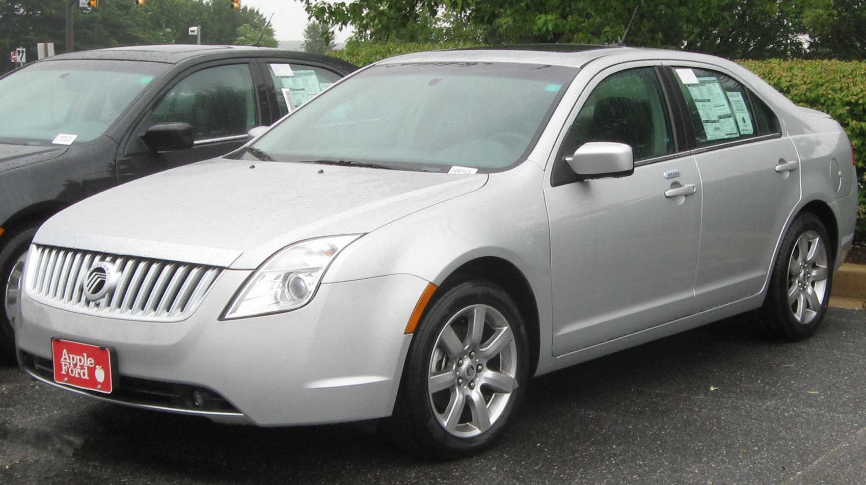 Front and side view of a mid-size sedan with chrome grill and alloy wheels