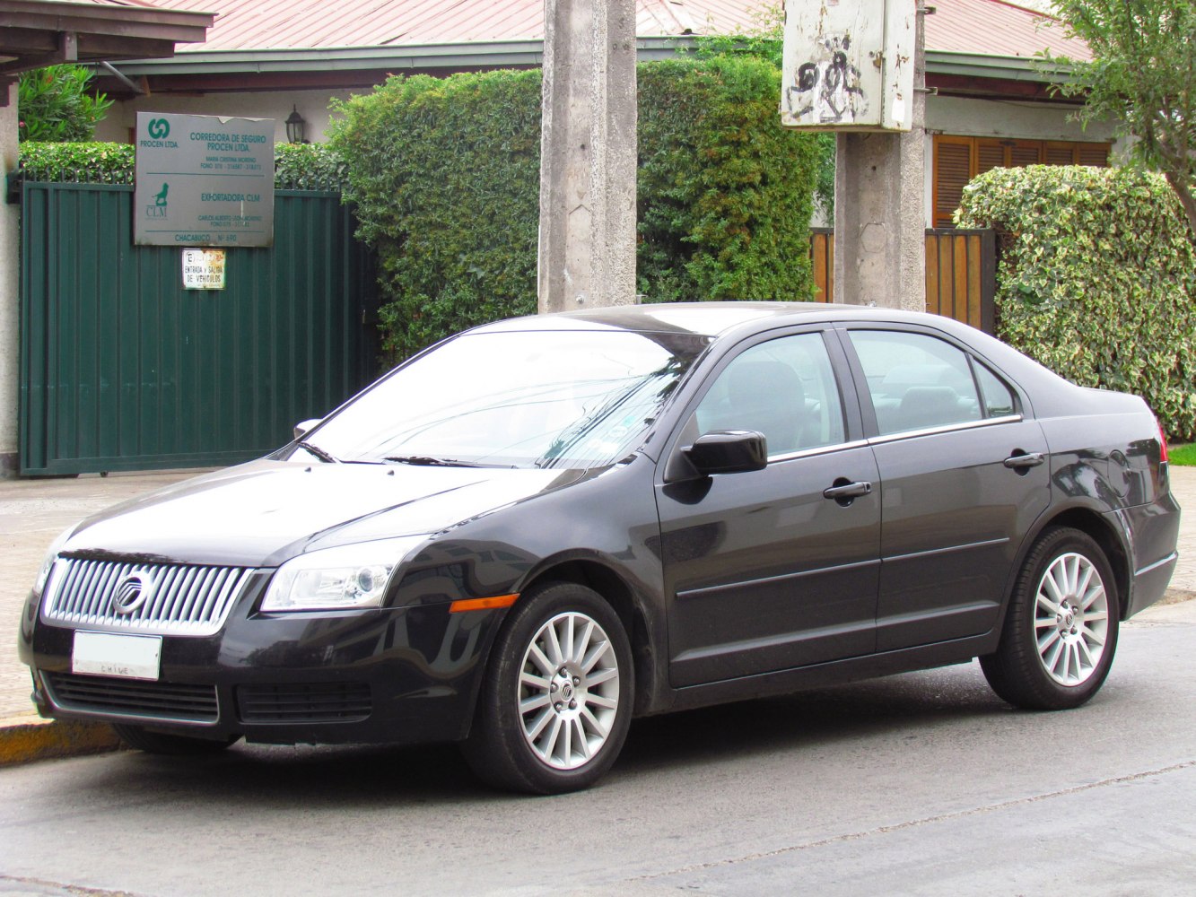 Front side view of mid-size sedan with distinctive grille and alloy wheels