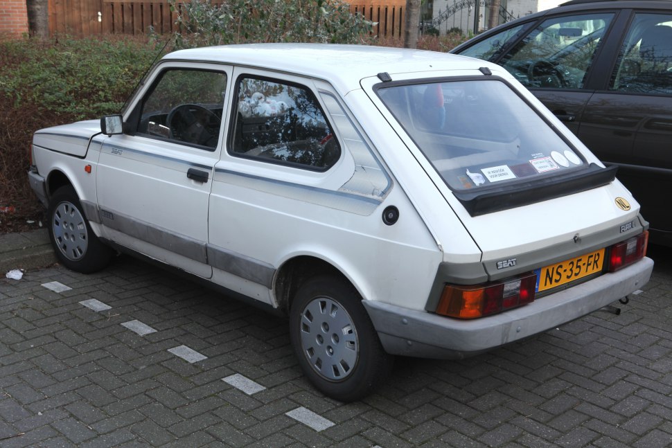 Rear-side view of a vintage hatchback with angular design and rear light cluster
