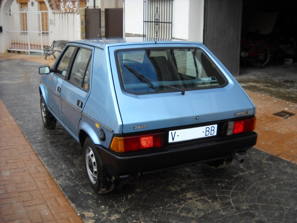 Box-shaped hatchback rear view with taillights and rear windshield wiper