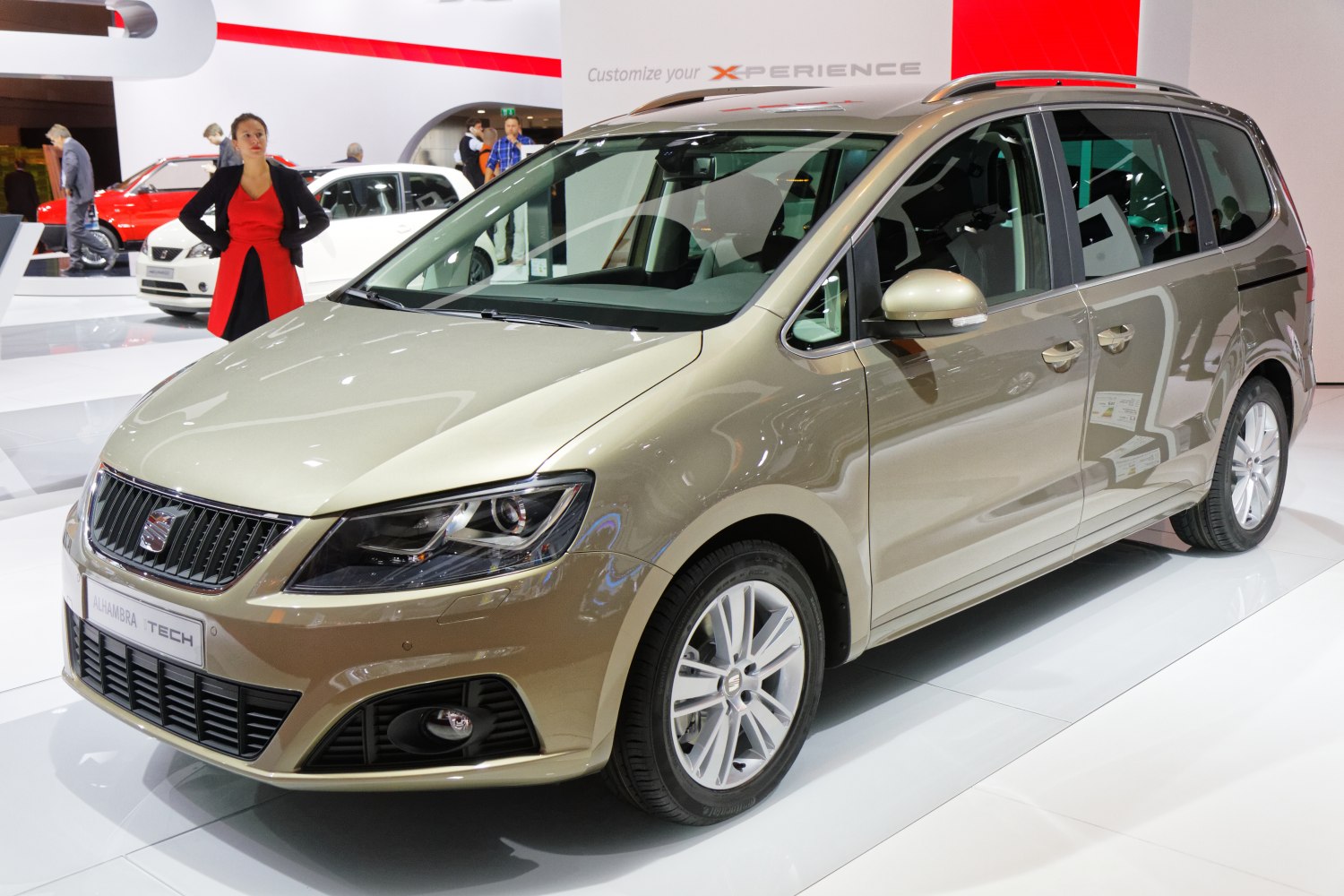 Front view of a sleek multi-purpose vehicle with distinctive grille and alloy wheels