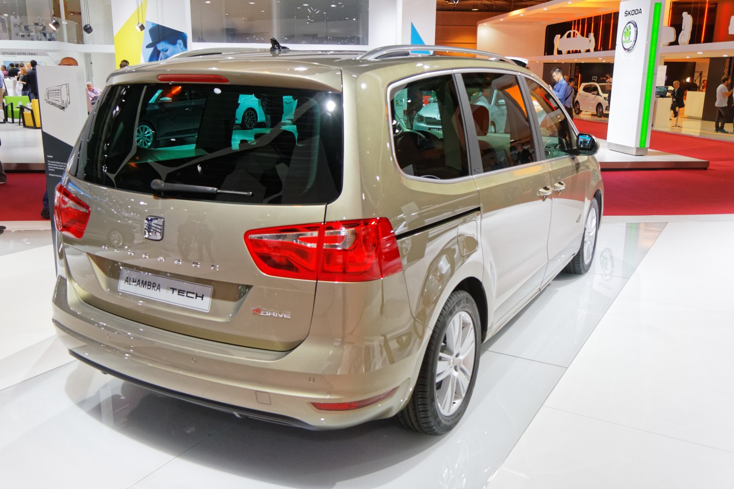 Rear and side view of a minivan with distinct tail lights and sliding rear doors