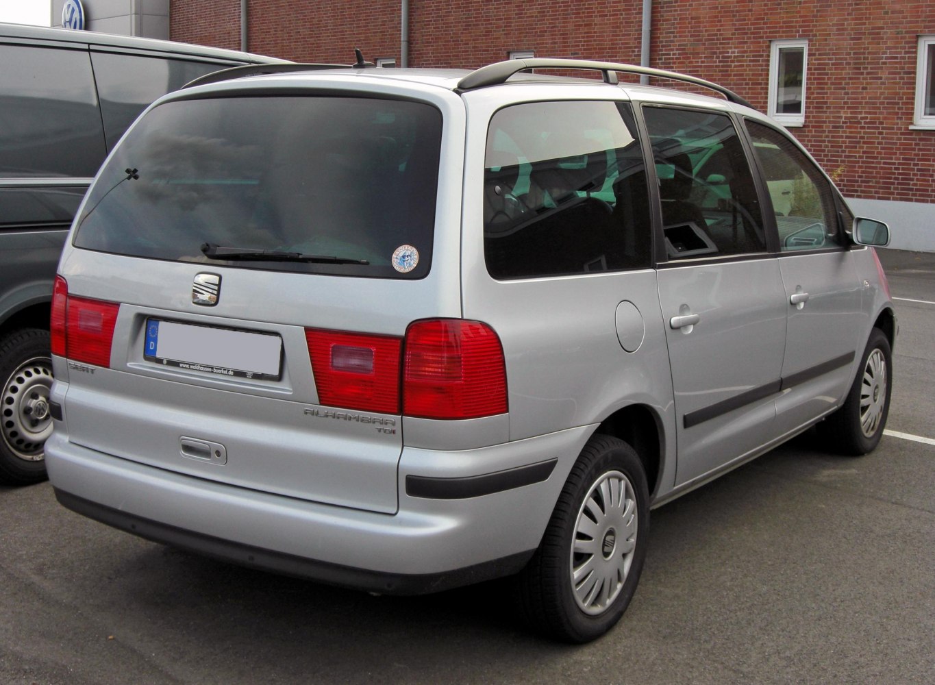 Minivan rear view with large rear window and distinct taillights