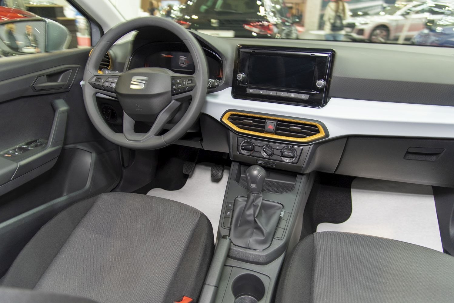 Digital instrument cluster and touchscreen infotainment system with climate controls.