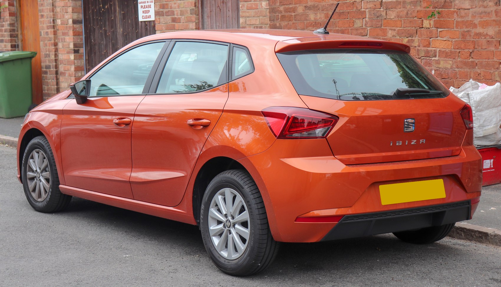 Orange hatchback with angular taillights and compact rear design