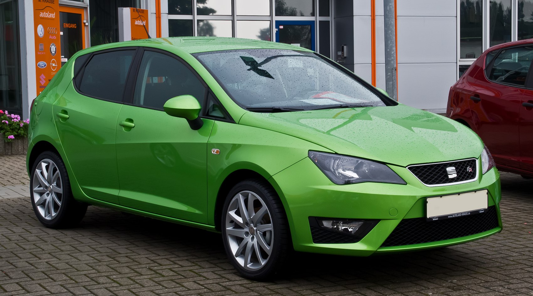 Green hatchback with alloy wheels and angular headlights