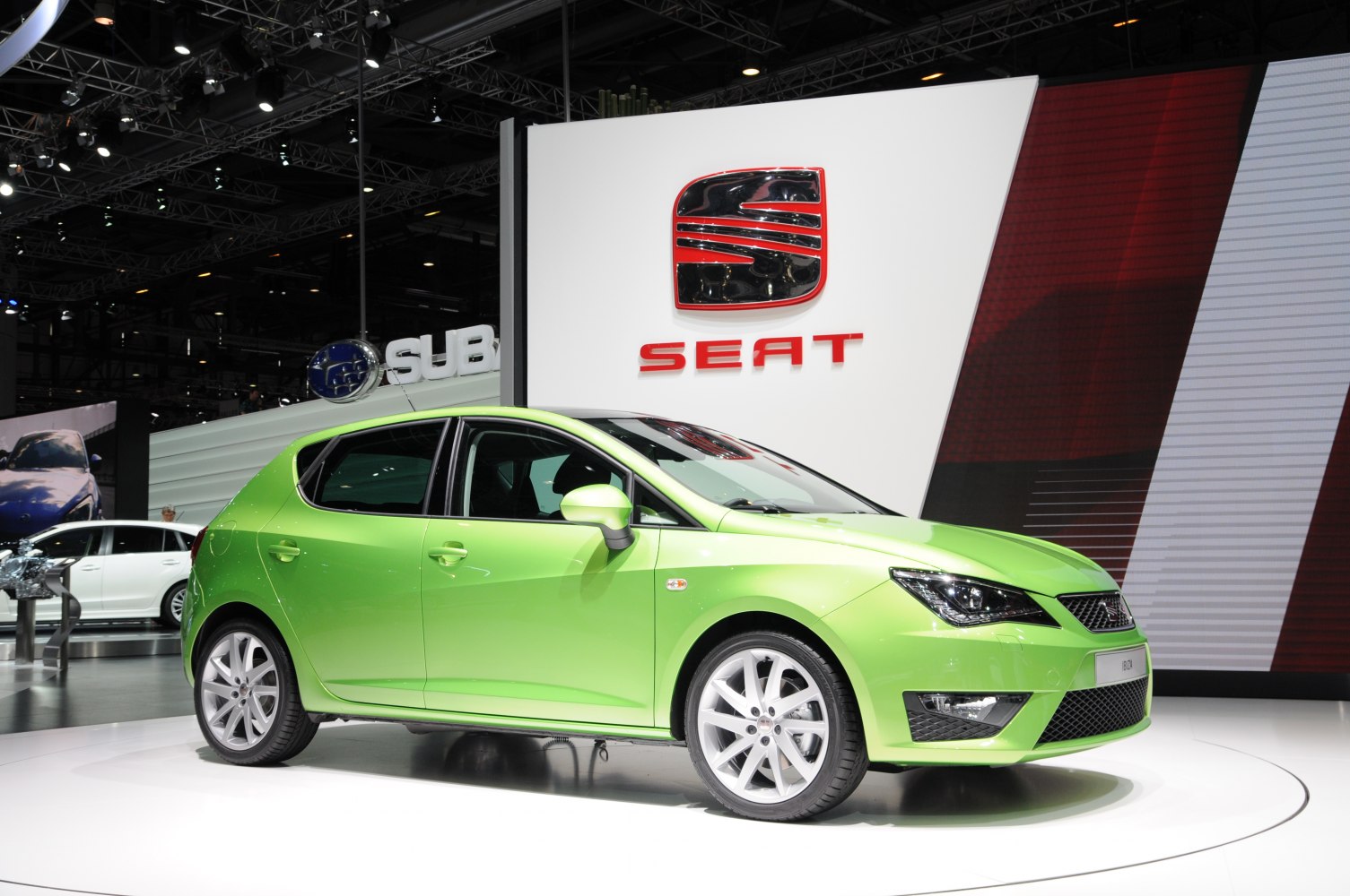 Green compact 5-door hatchback with sporty headlights