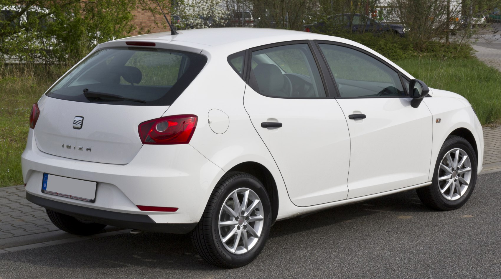 Rear and side profile of a compact hatchback with modern tail lights and alloy wheels
