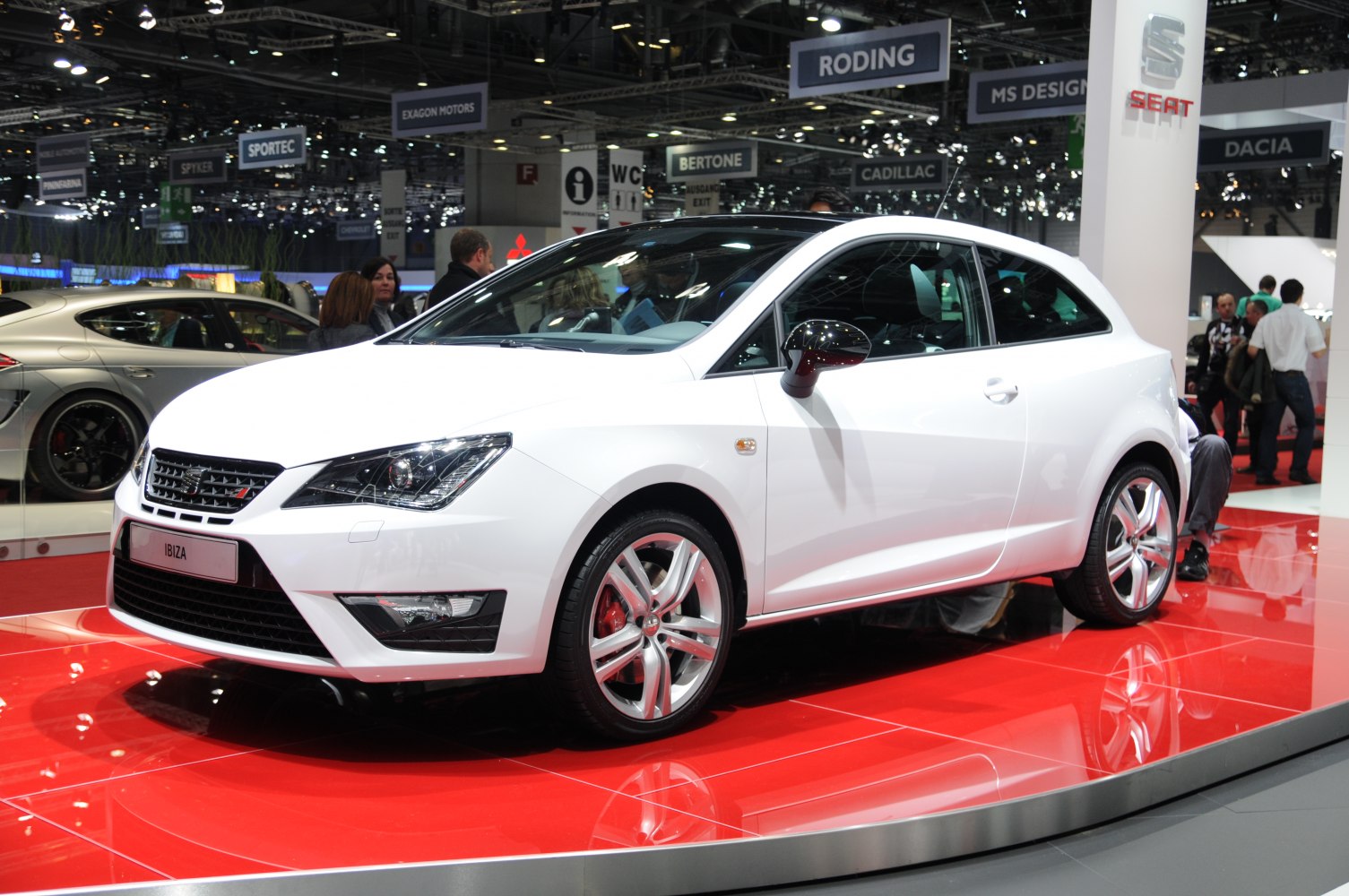 White hatchback with sporty alloy wheels and sharp headlights