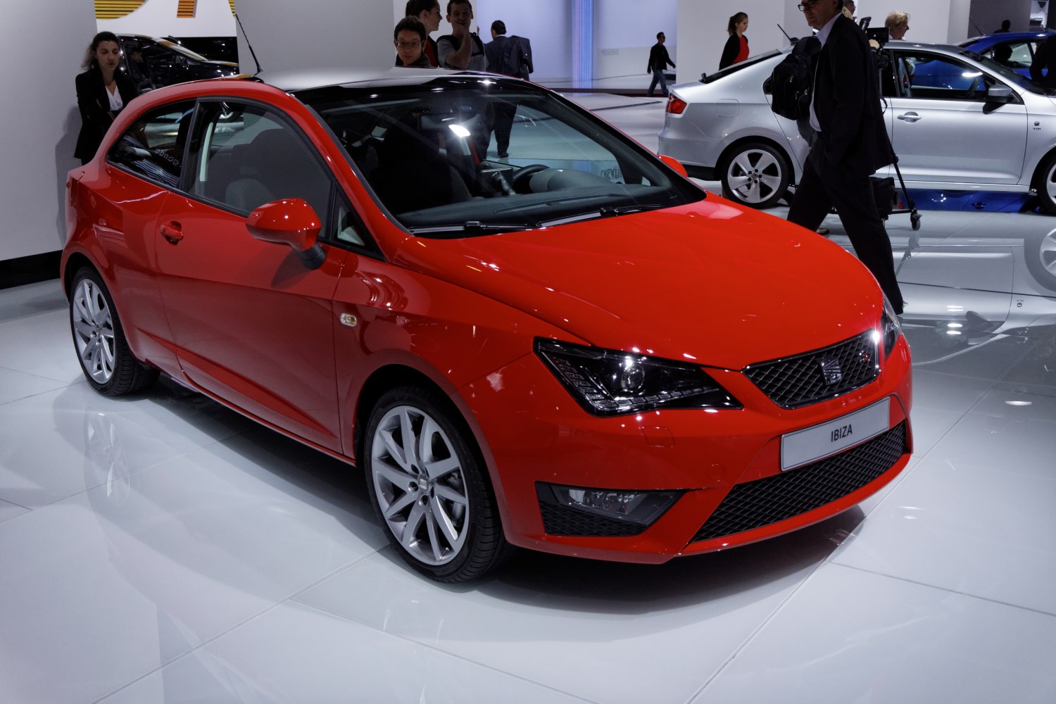 Red hatchback with sporty front and LED headlights