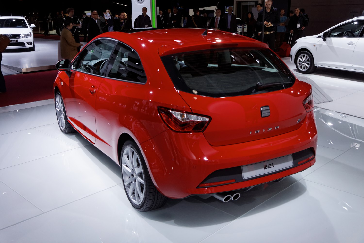 Rear hatchback view with dual exhaust and angular tail lights