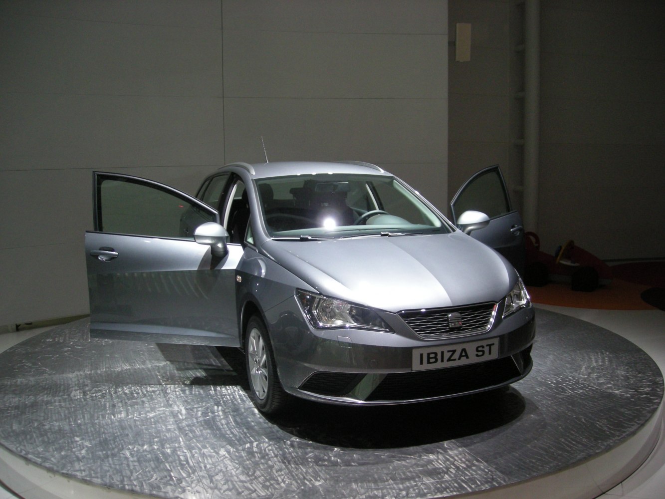 Silver compact hatchback front with open driver and passenger doors