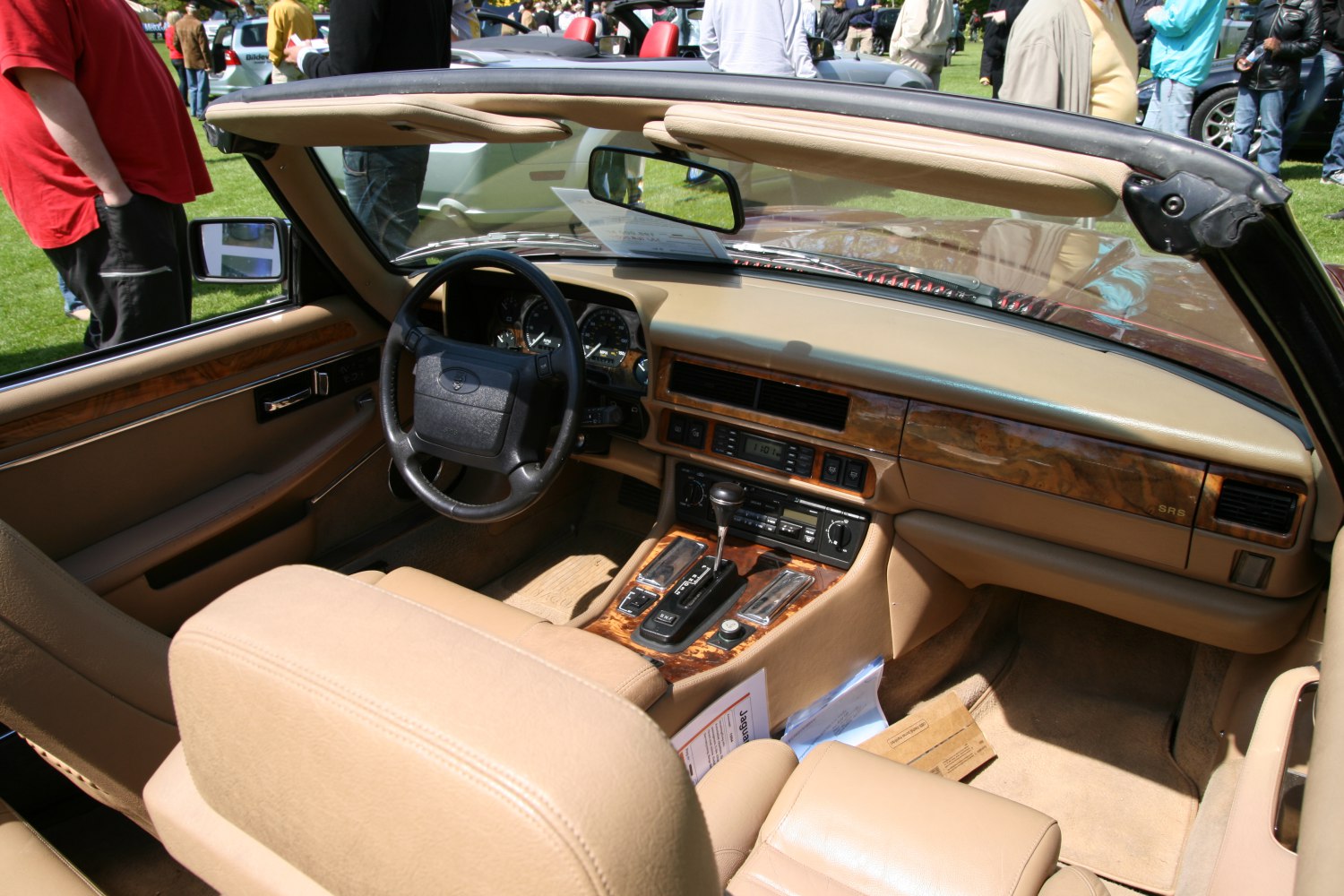 Beige leather and wood dashboard interior of classic convertible
