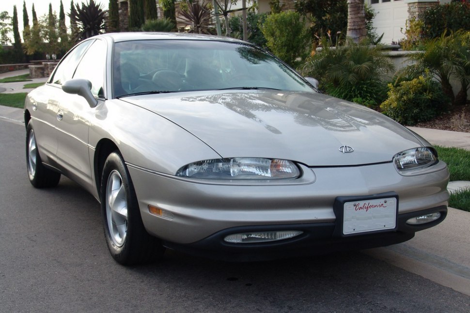 Front view with curved headlights and smooth aerodynamic body.