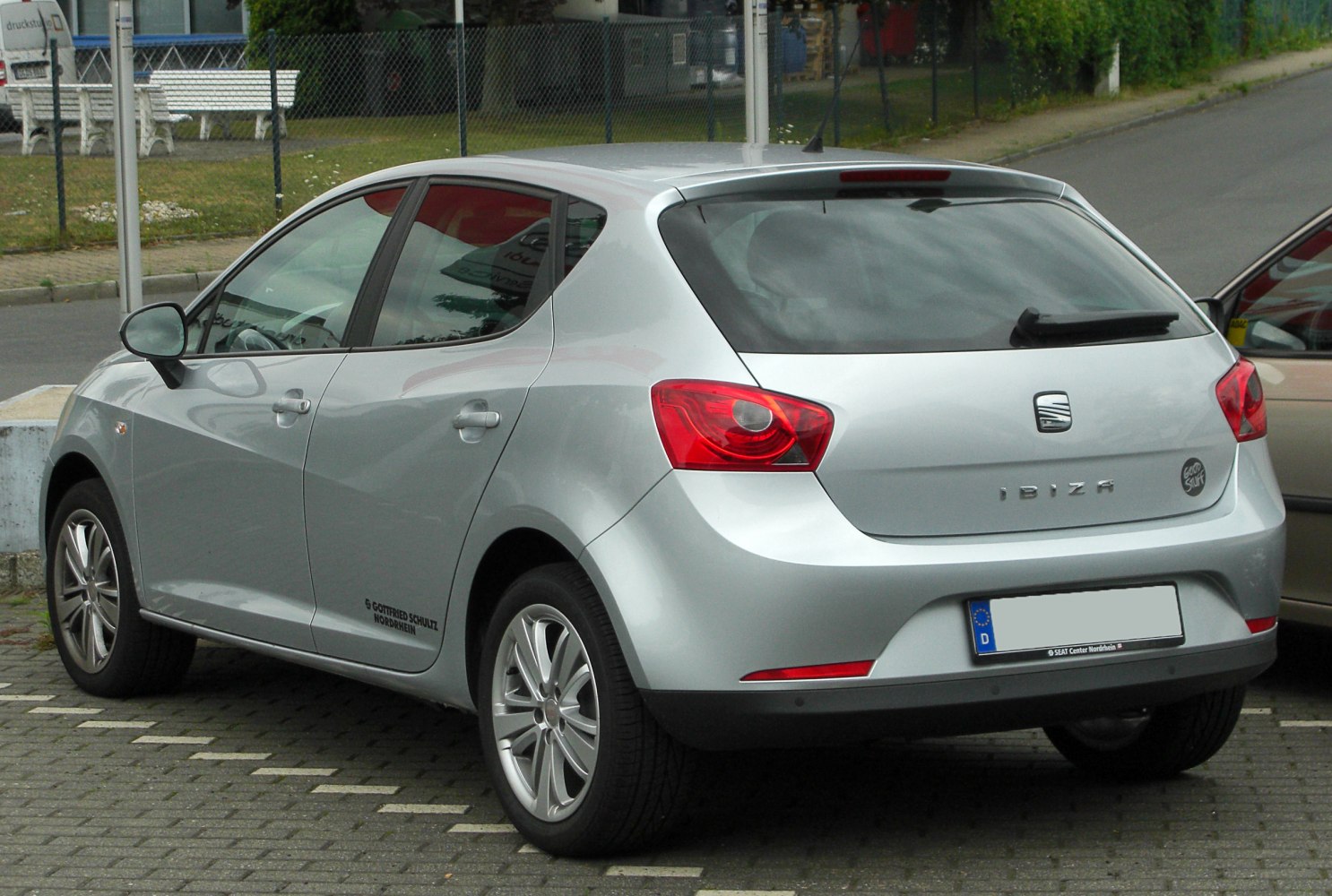 Silver 5-door hatchback rear and side view with distinctive rear lights