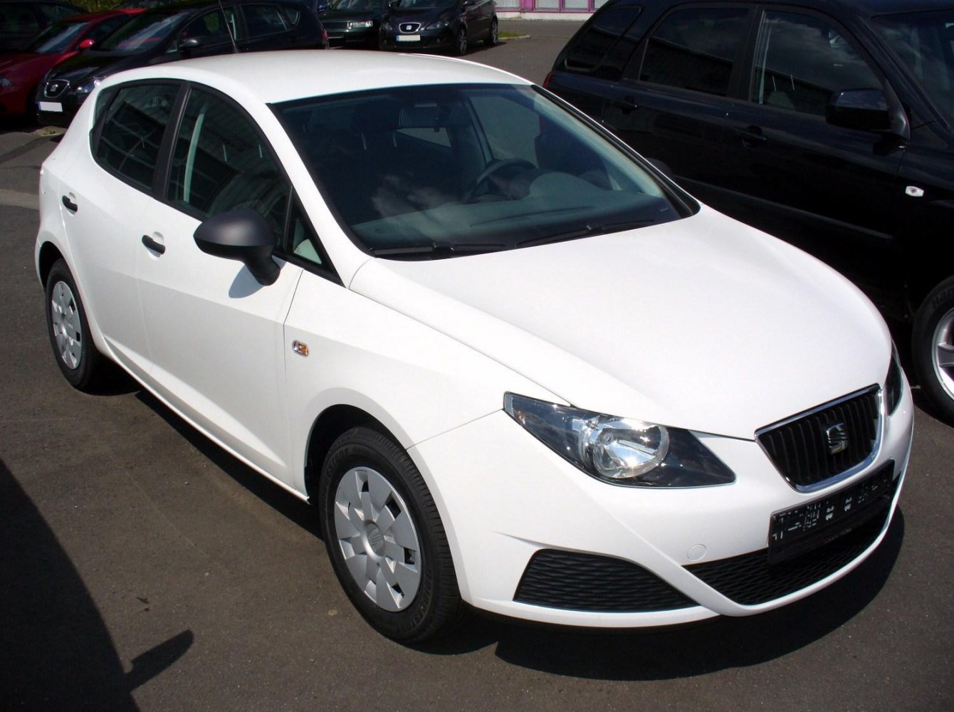 White 5-door hatchback car showing front and side features