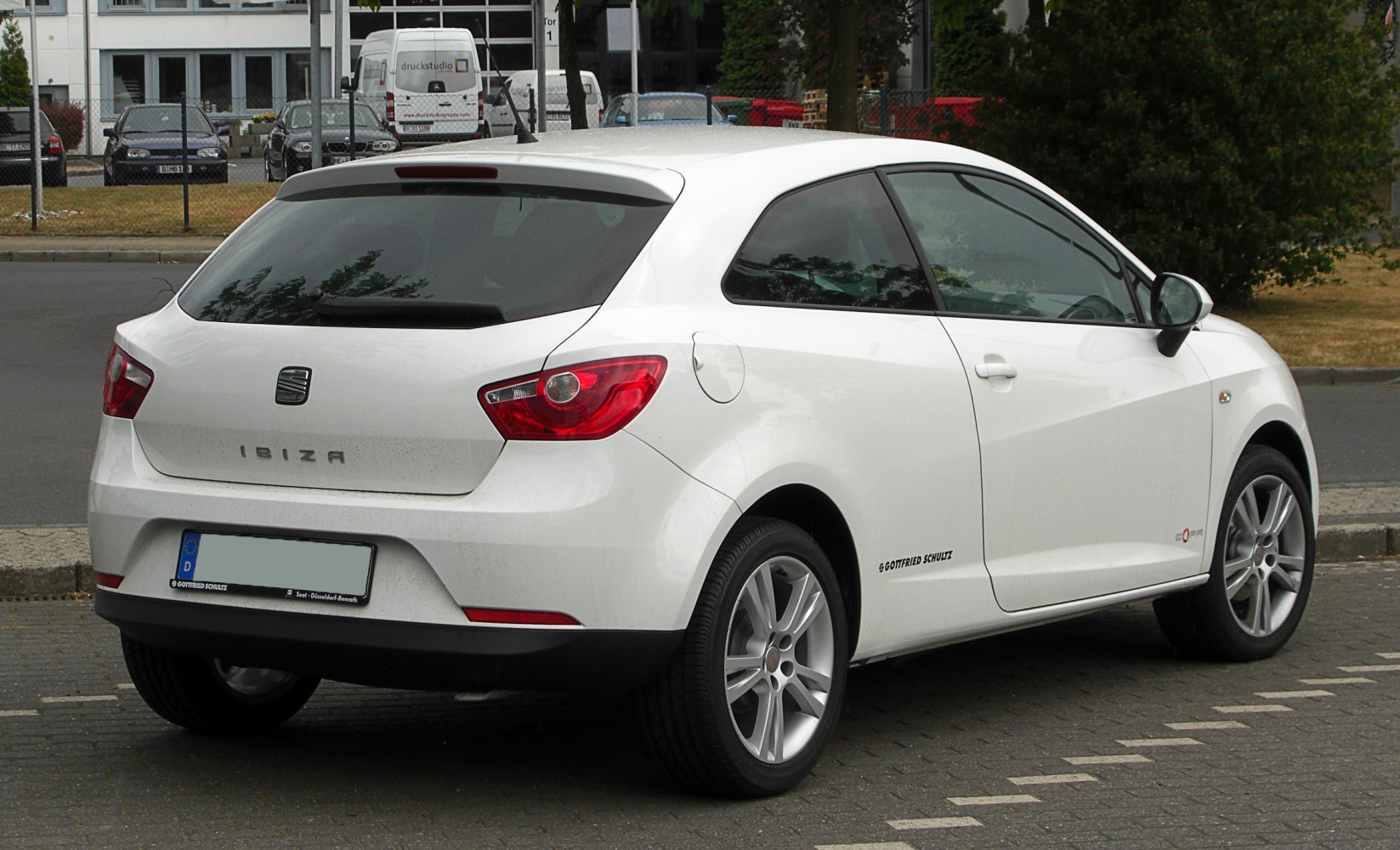 White 3-door hatchback rear with tinted windows and modern tail lights