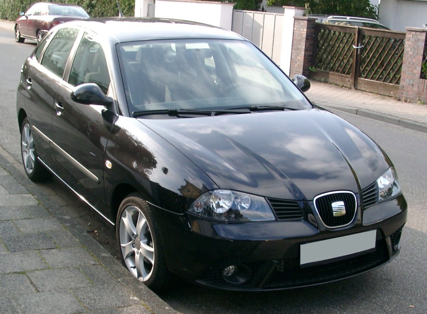 Front-side view with headlights and alloy wheels of a compact hatchback