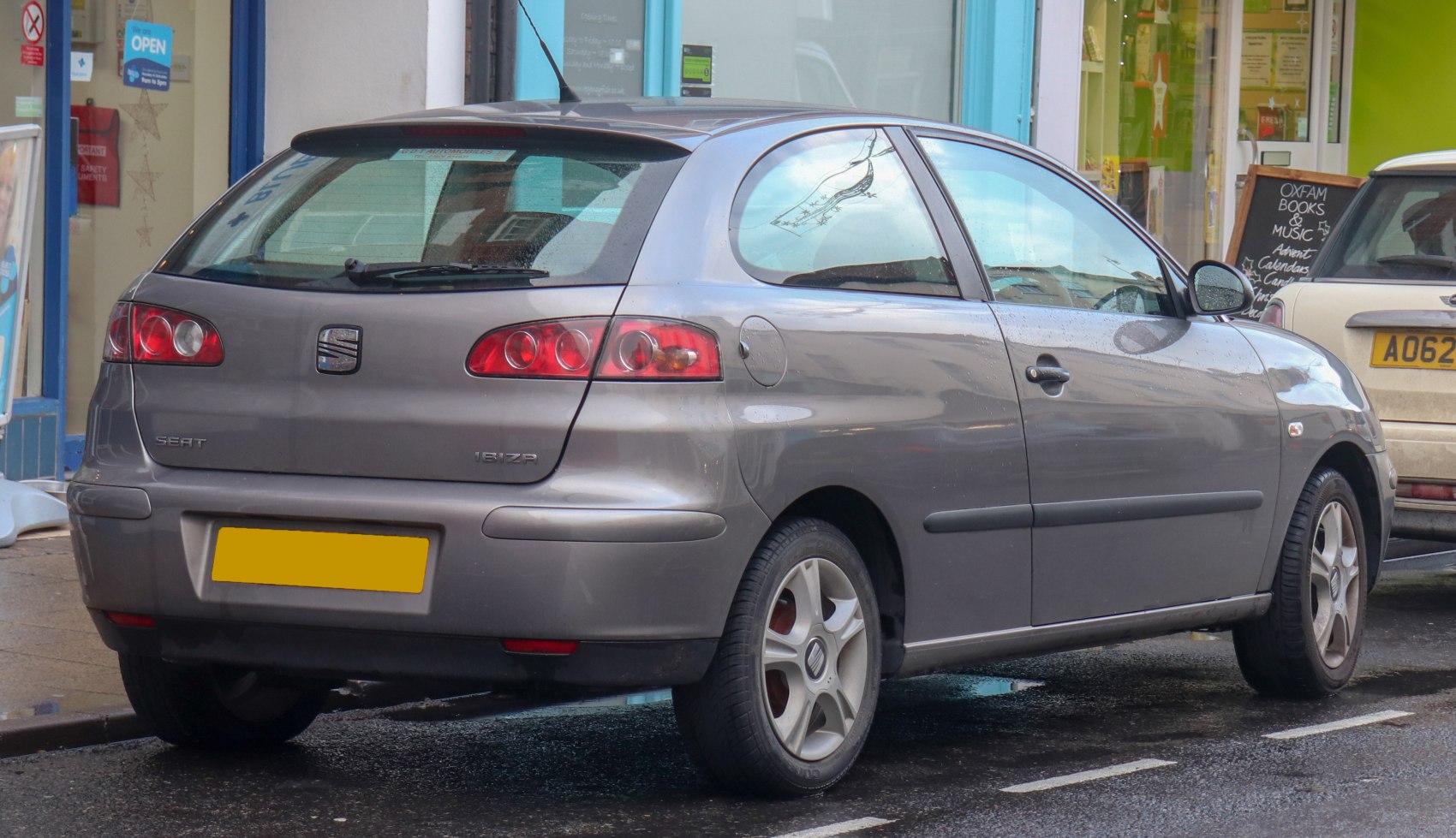 Rear and side view of hatchback with distinct tail lights and alloy wheels