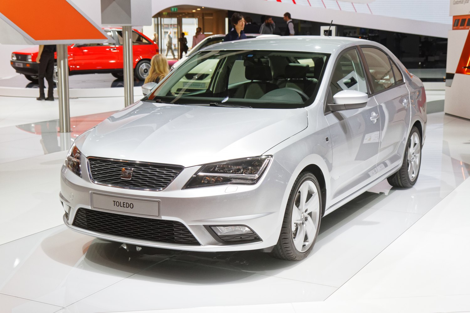 Silver sedan with sharp grille and angular headlights