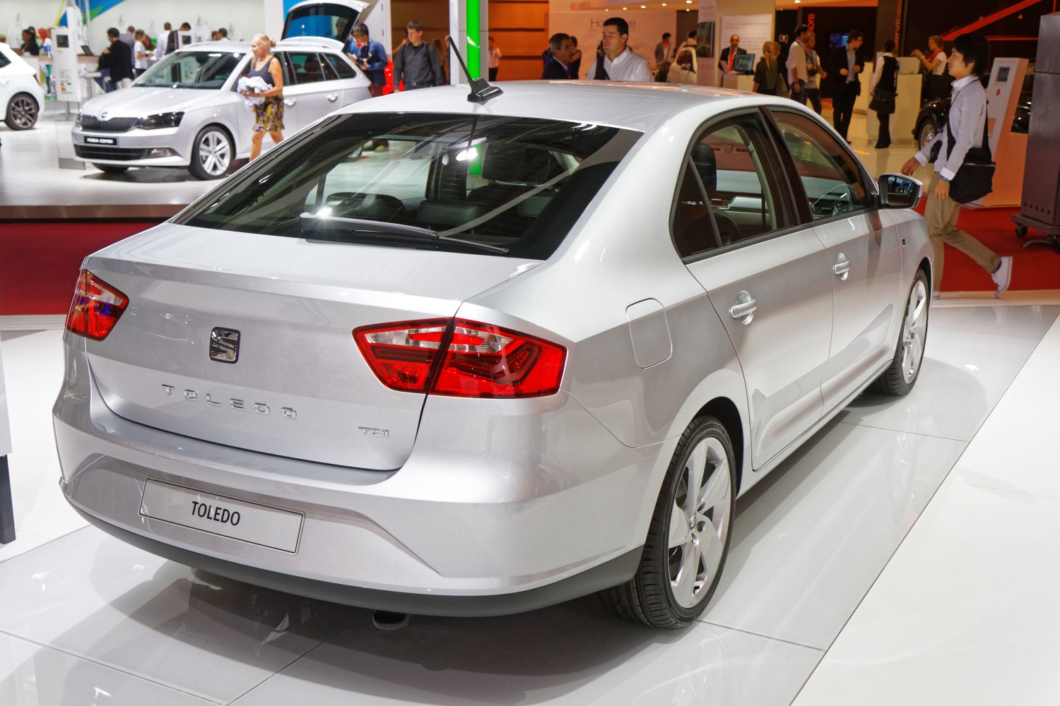 Silver sedan rear with distinctive angular taillights and clean body lines