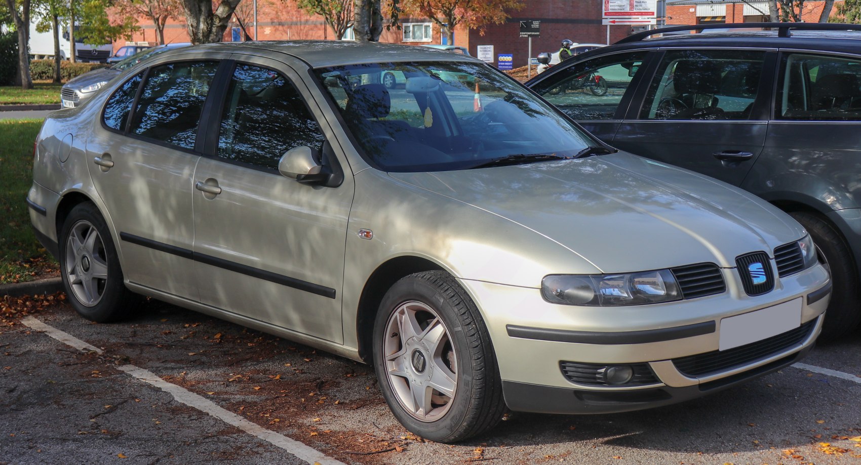 Front and side view of a mid-size sedan with alloy wheels parked outdoors