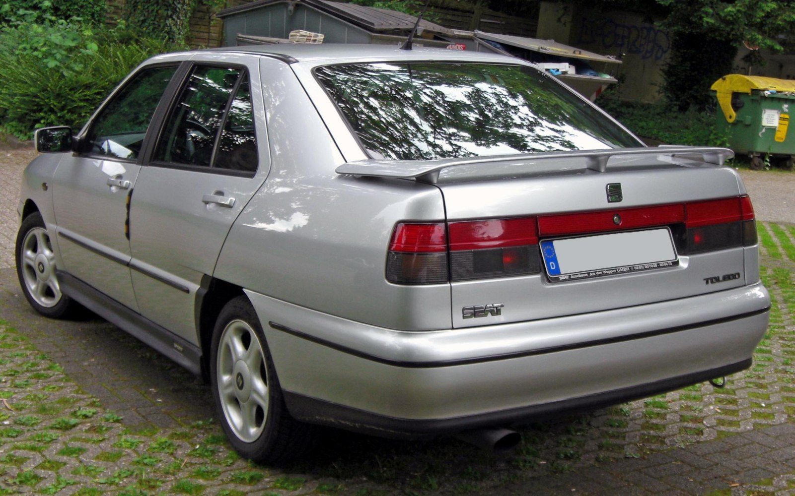 Rear view of a hatchback with spoiler and distinct tail lights