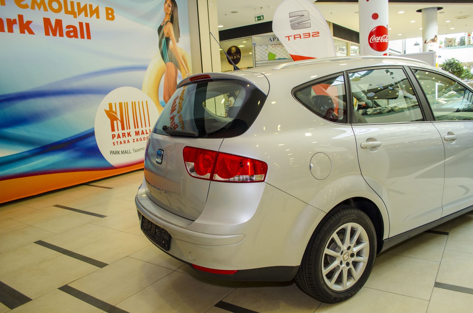Silver mid-size hatchback rear and side view with modern taillights and alloy wheels
