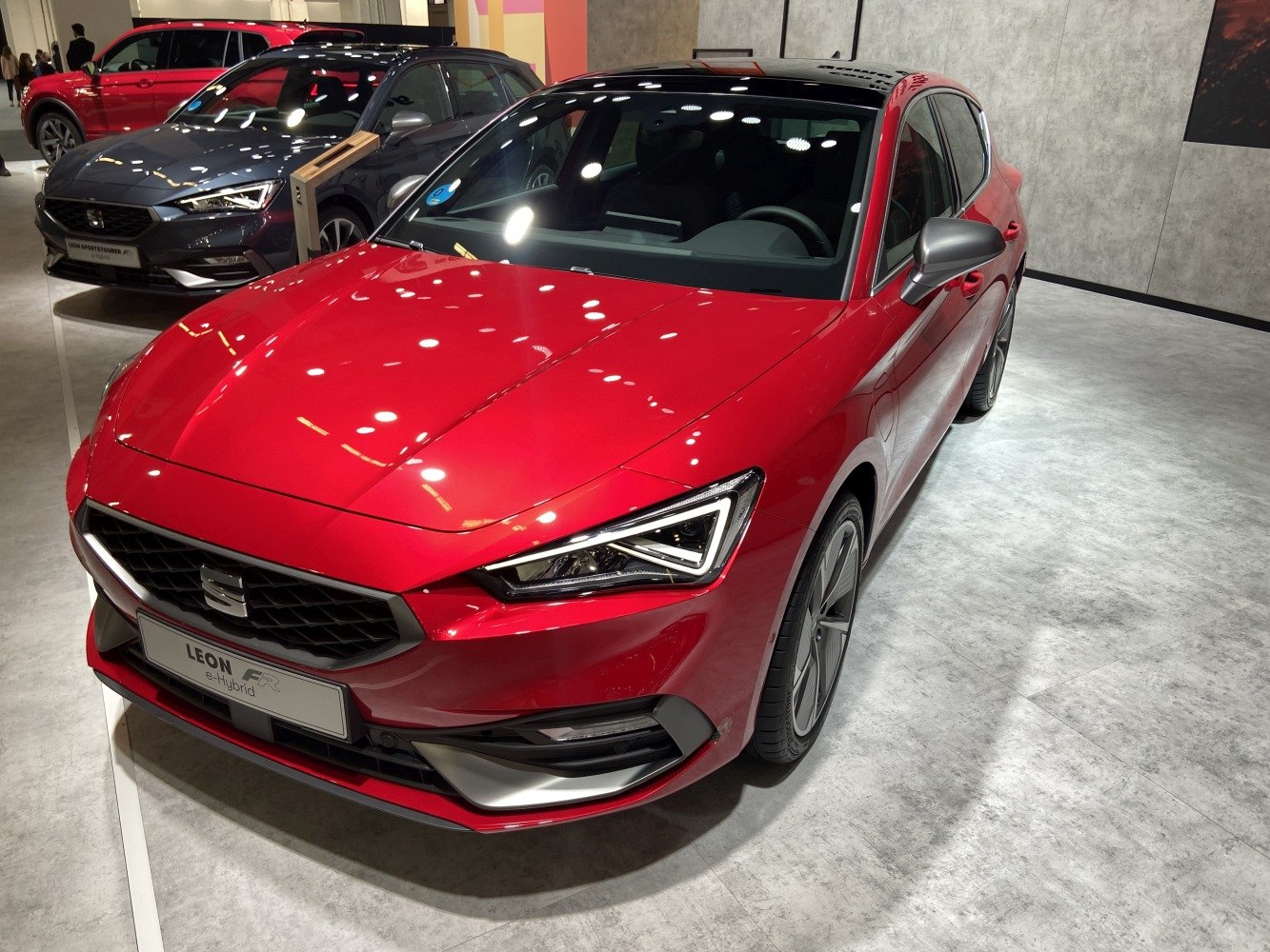 Sharp LED headlights and aerodynamic hatchback front design.