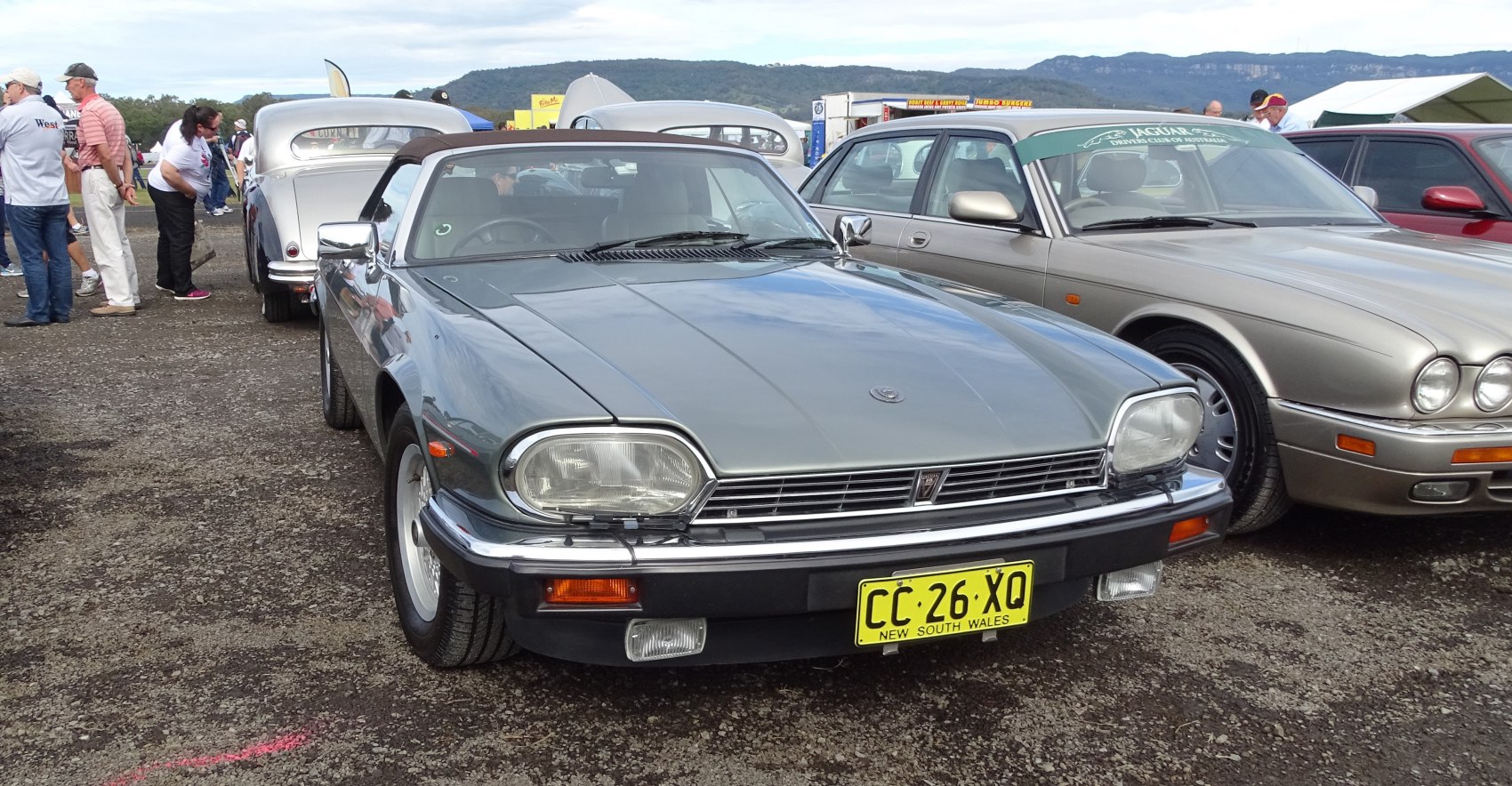 Front view of a classic convertible with distinctive rectangular headlights and chrome grille