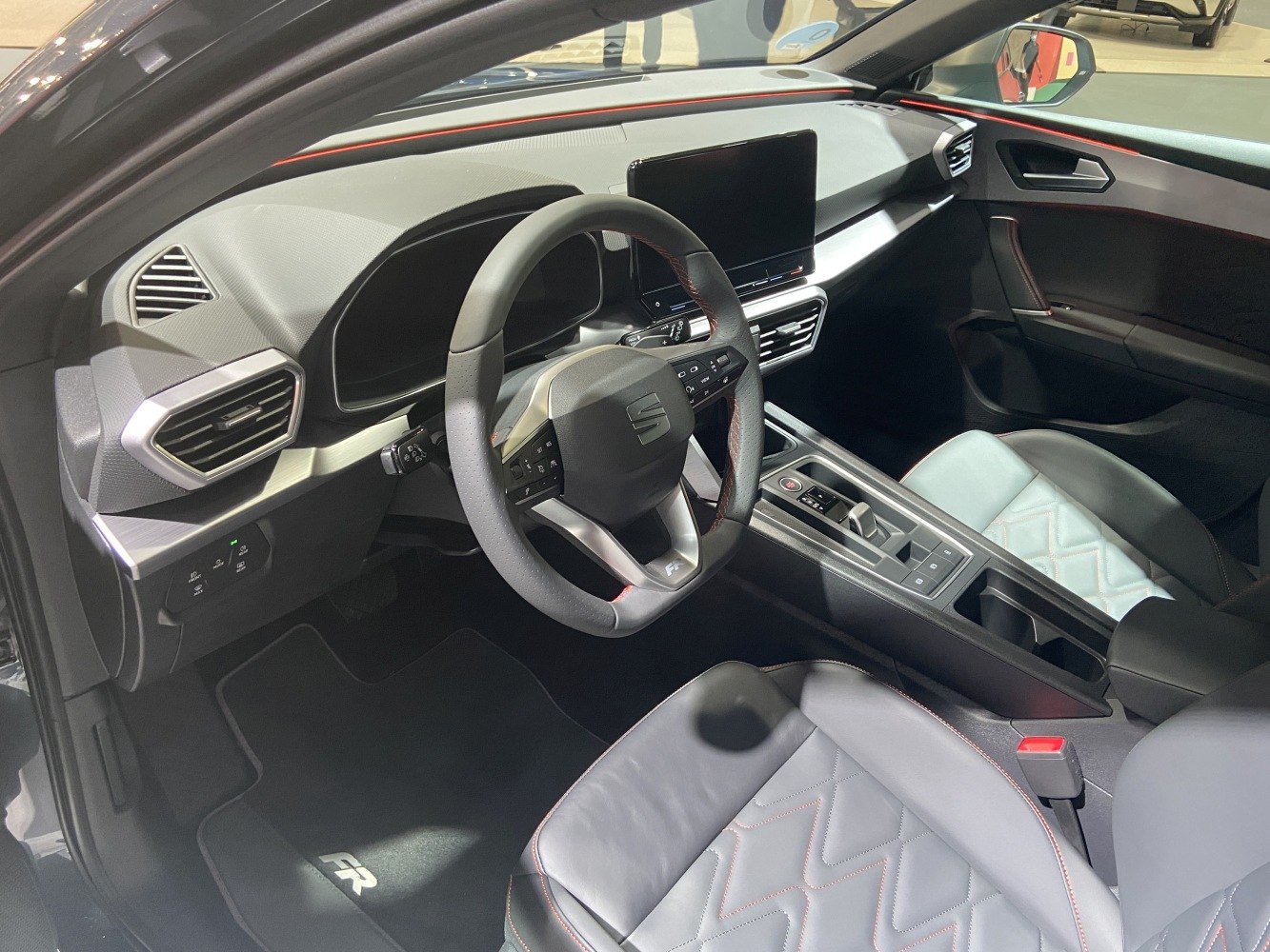 Steering wheel and digital dashboard with quilted leather seats