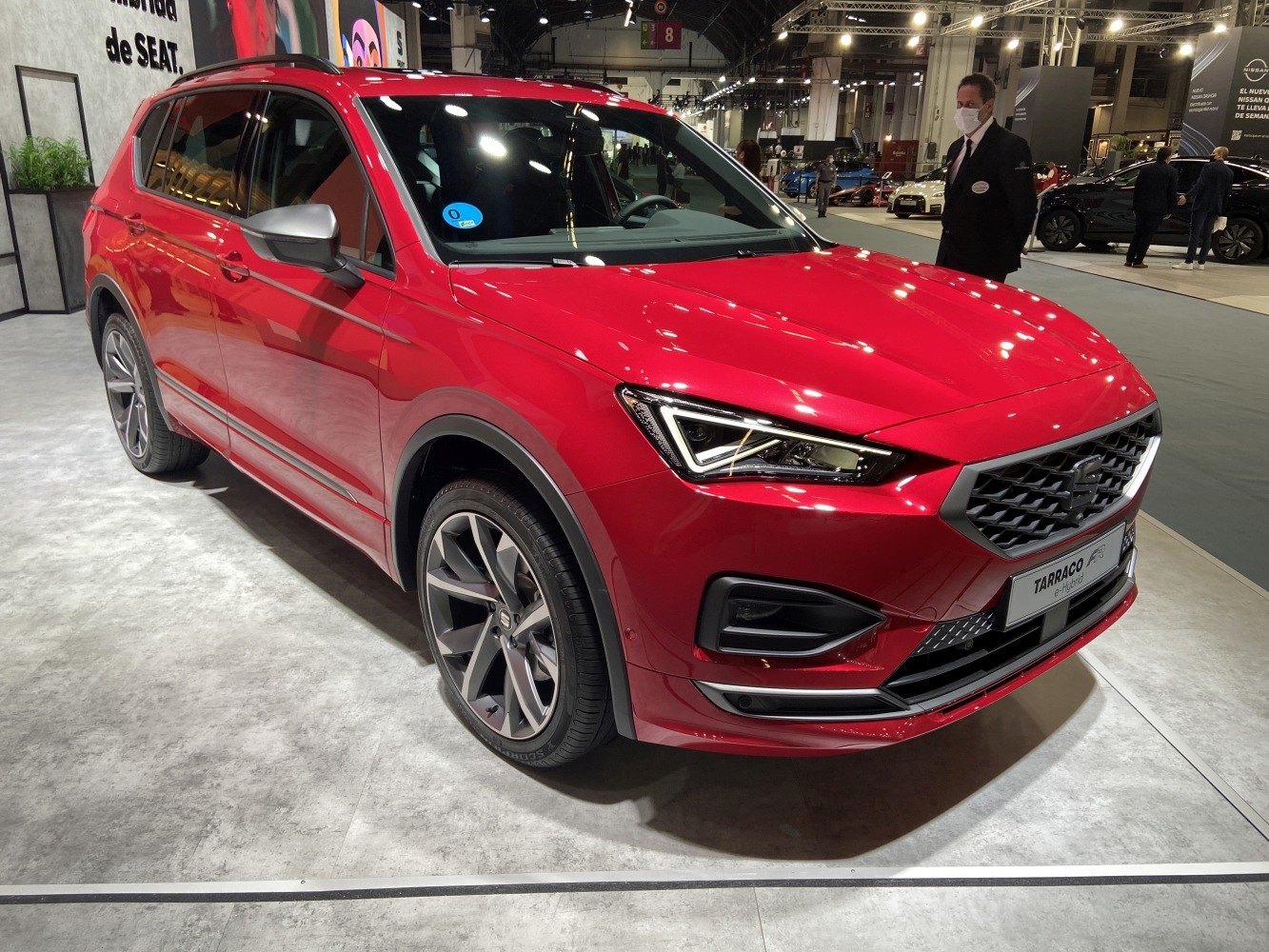 Sporty red SUV with sharp angular LED headlights and alloy wheels