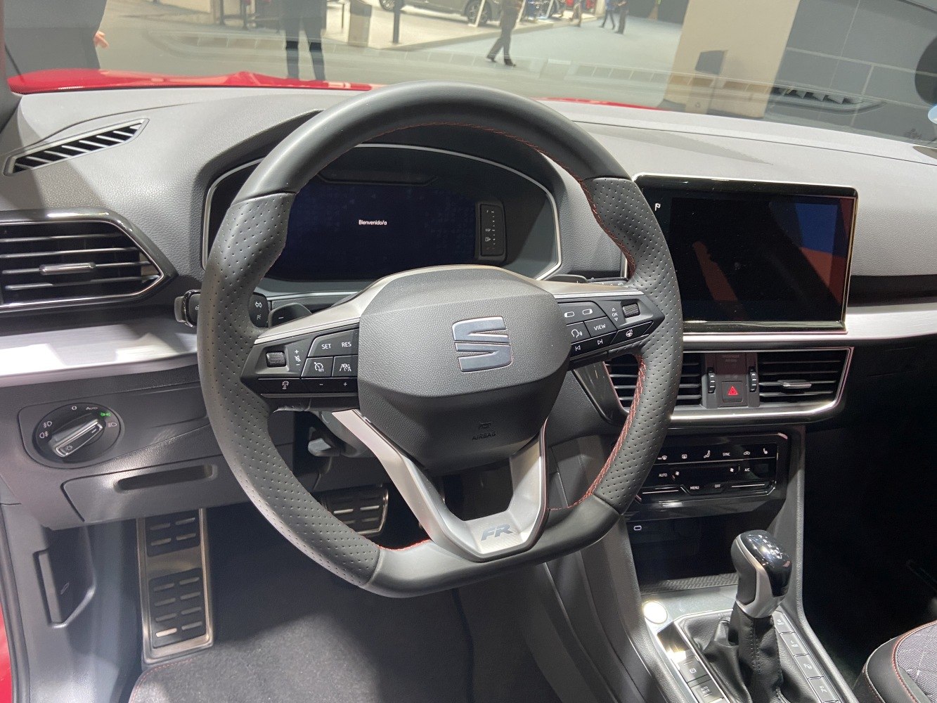 FR steering wheel and digital dashboard in a modern car interior